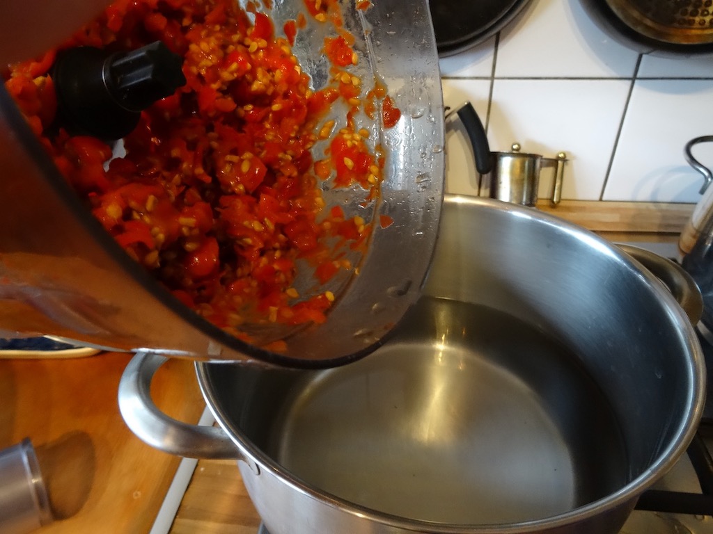 add mushed rose hips to boiling water